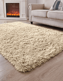 Soft beige shag rug in a cozy living room with a fireplace