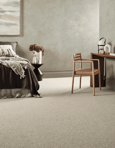 Minimalist beige carpet in a modern bedroom